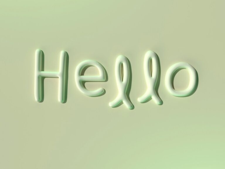 3D text 'Hello' with glossy green finish