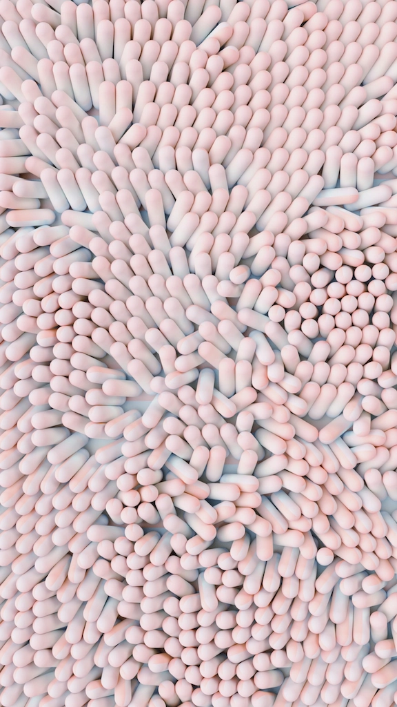Dense cluster of pink and white capsules in pattern