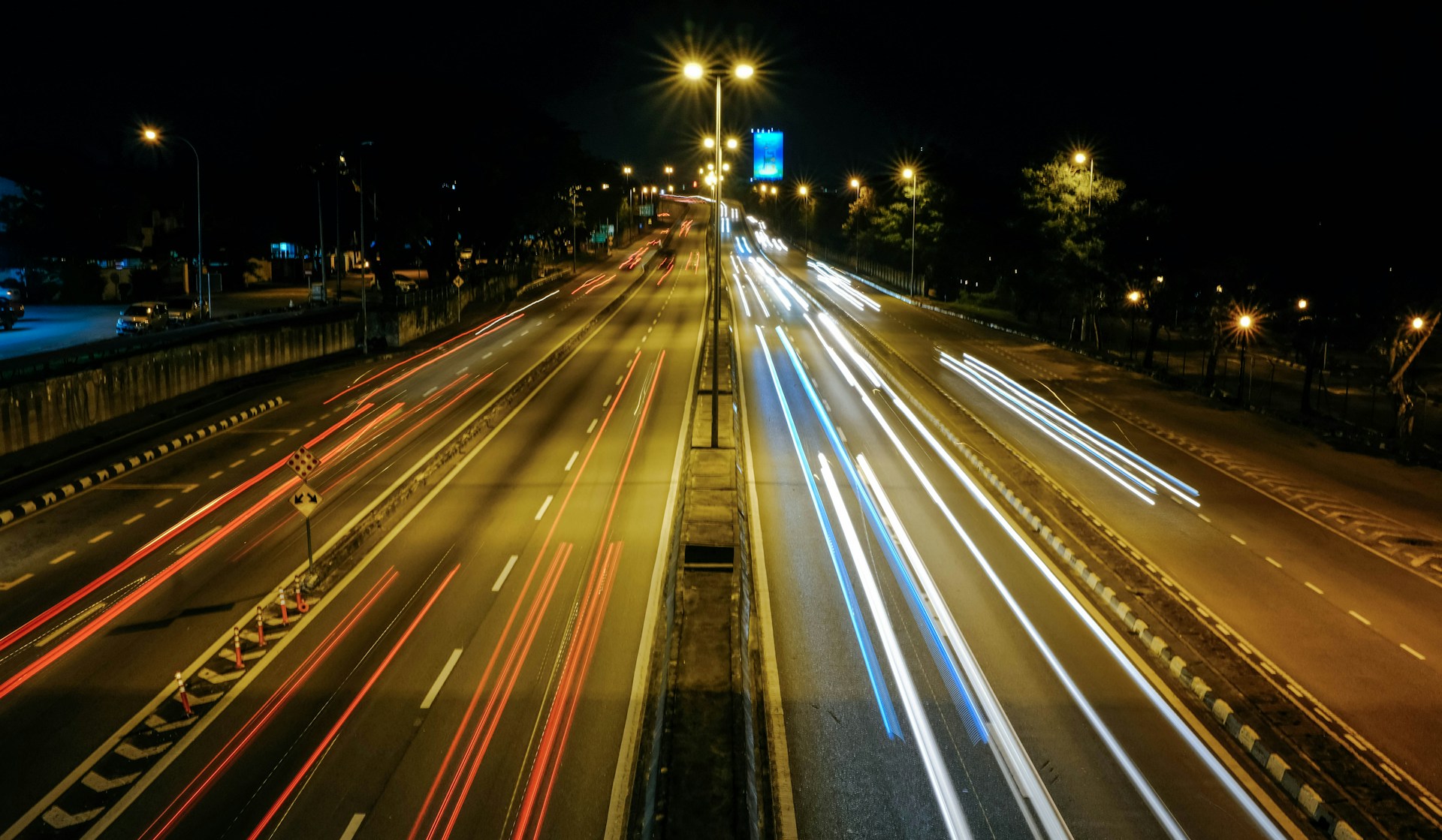 Long exposure traffic lights on city highway at night
