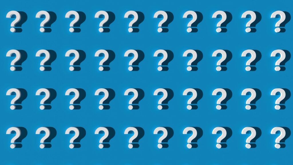Multiple white question marks on blue background