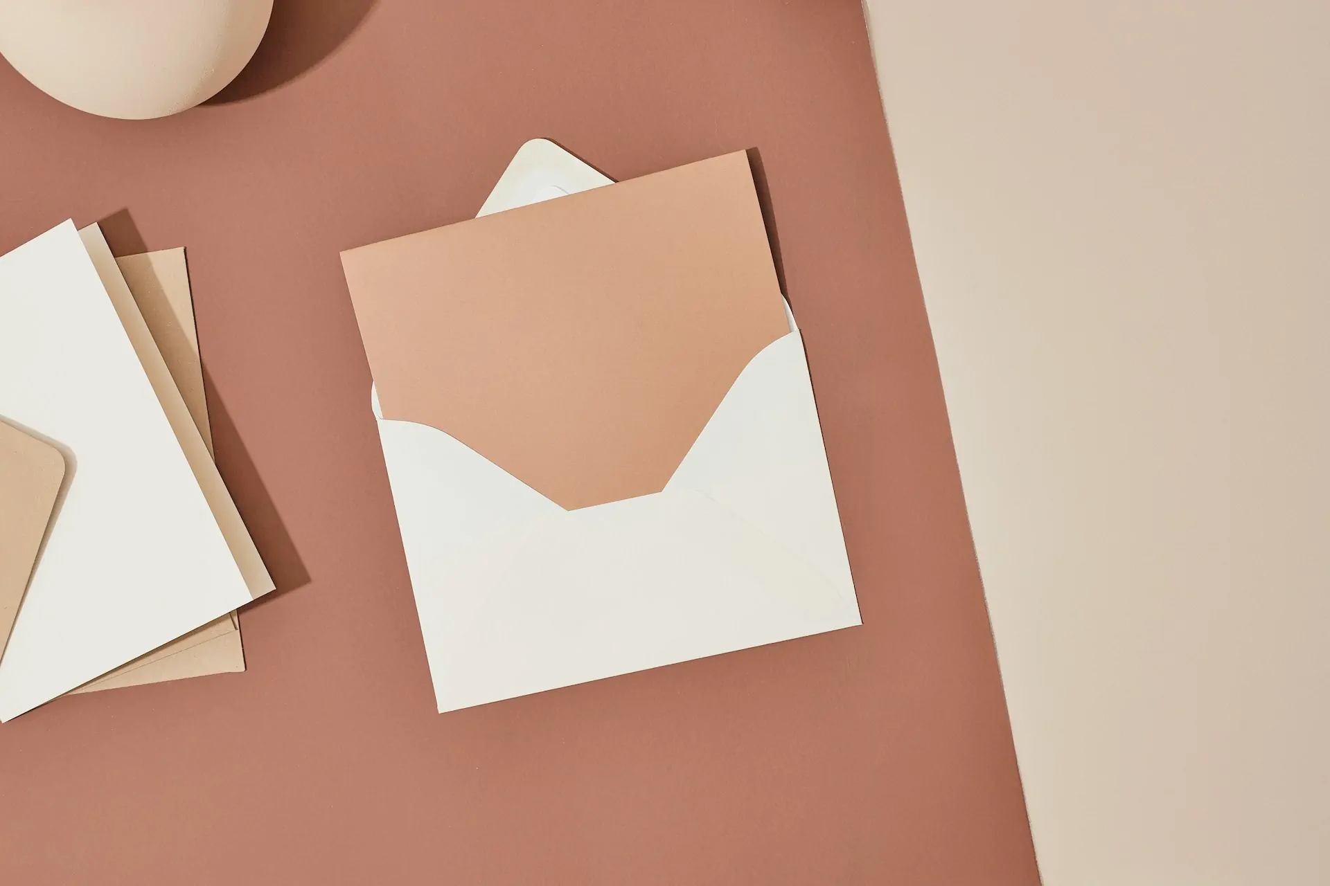 Stylish stationery mockup with envelopes on brown background