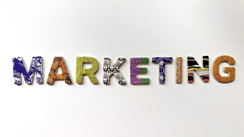 Colorful patterned letters spelling MARKETING on white background