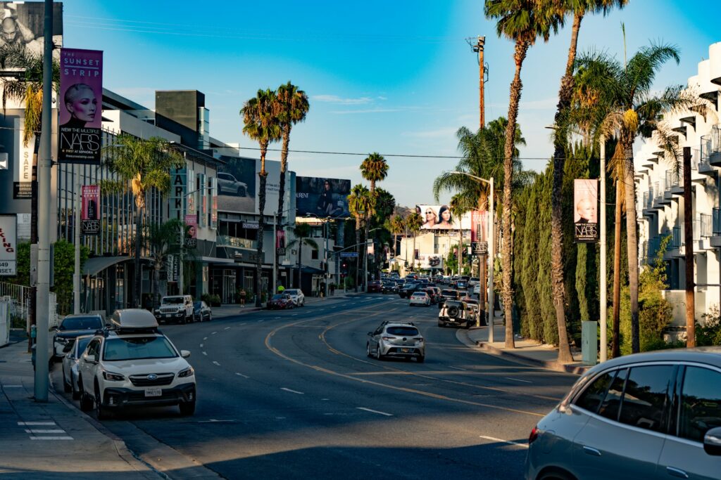 Sunset Boulevard lined with palm trees and billboards in West Hollywood